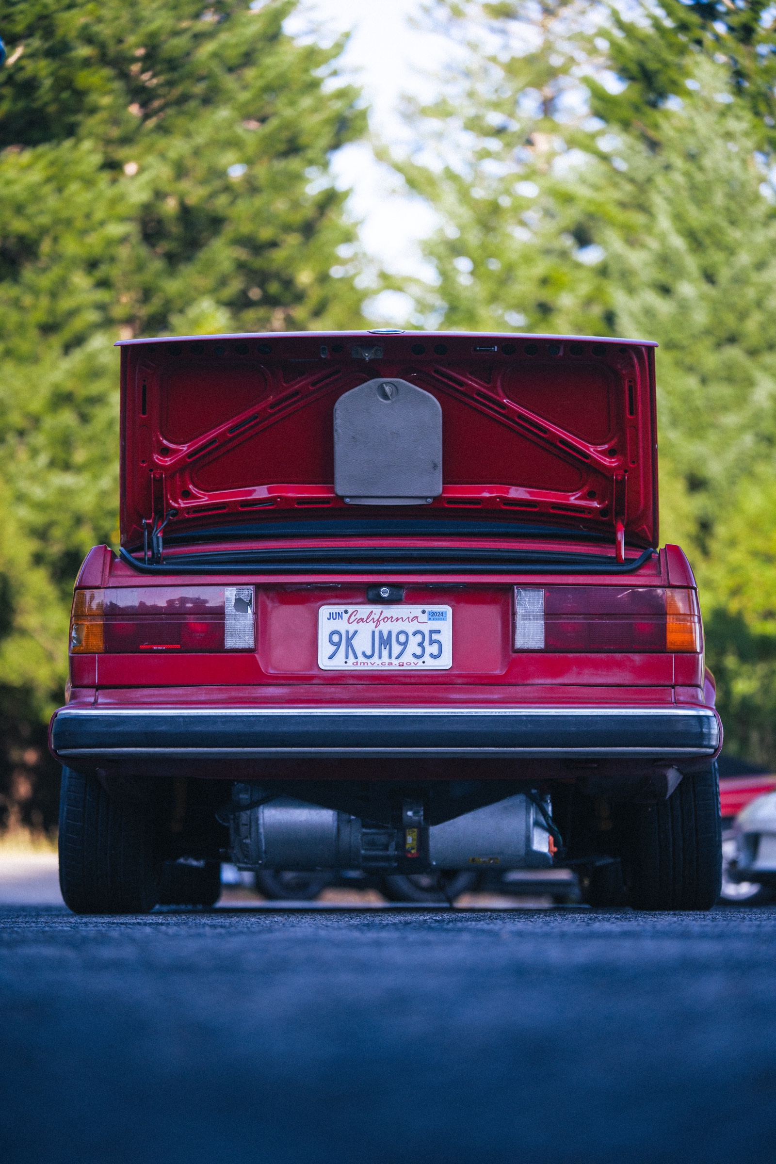 Rear view of the converted red BMW E30